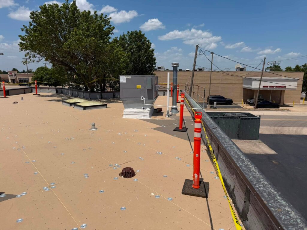 Commercial Flat Roof — Tree & Water Tower — photo 4