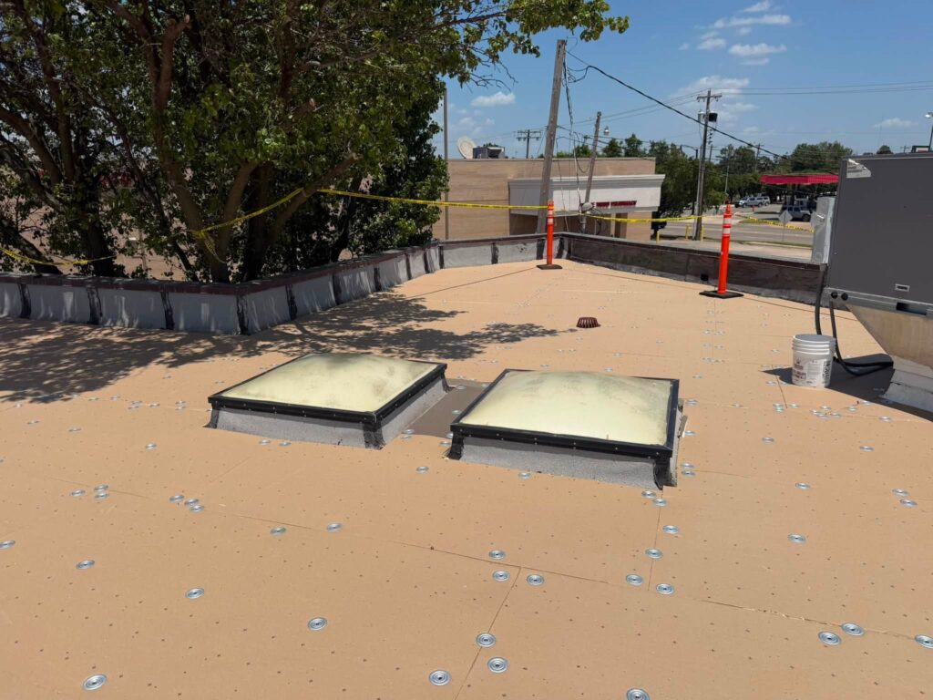 Commercial Flat Roof — Tree & Water Tower — photo 11