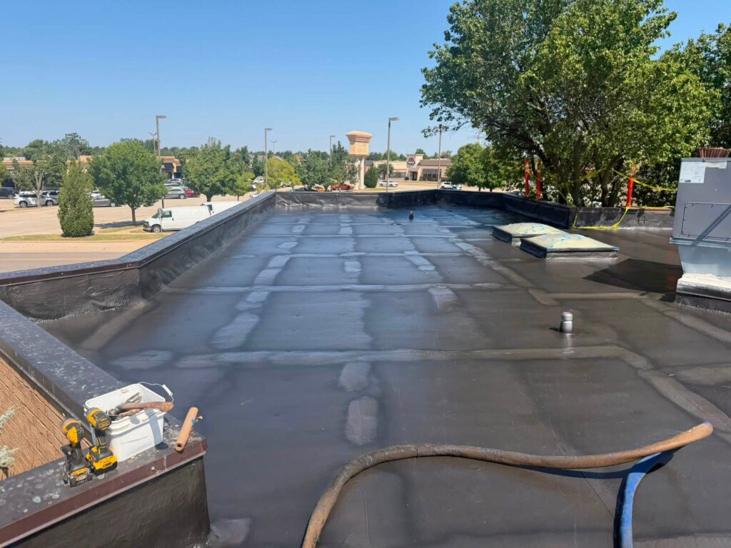 Commercial Flat Roof — Tree & Water Tower — photo 13