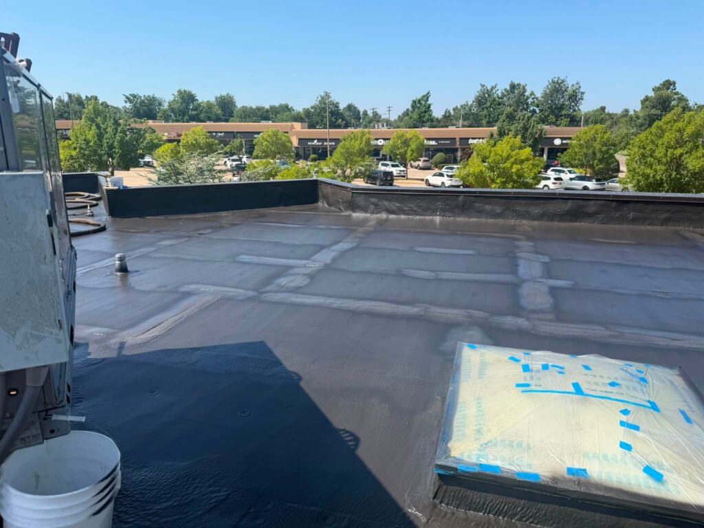Commercial Flat Roof — Tree & Water Tower — photo 17