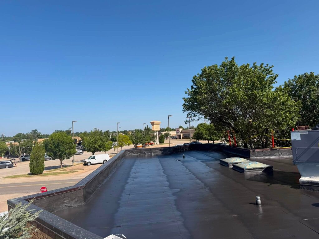 Commercial Flat Roof — Tree & Water Tower — photo 19