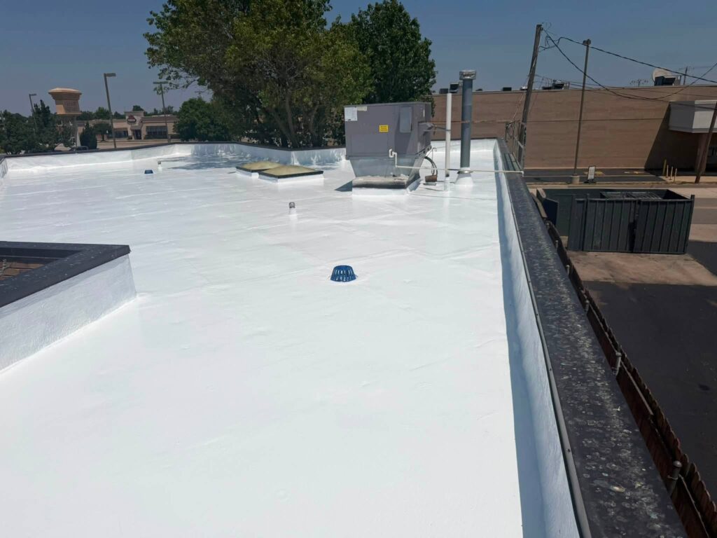 Commercial Flat Roof — Tree & Water Tower — photo 24
