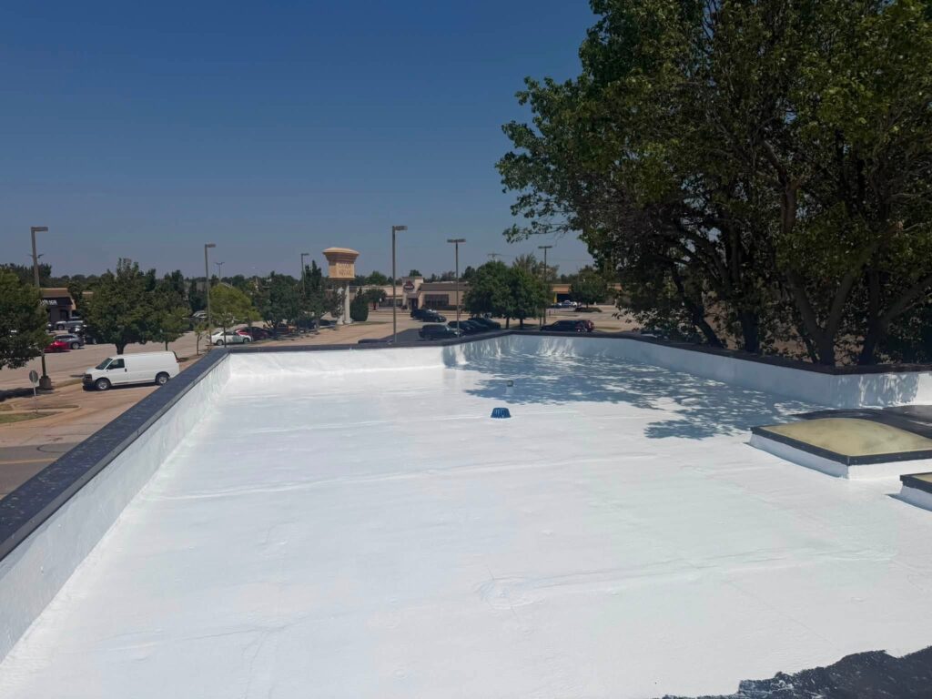 Commercial Flat Roof — Tree & Water Tower — photo 25
