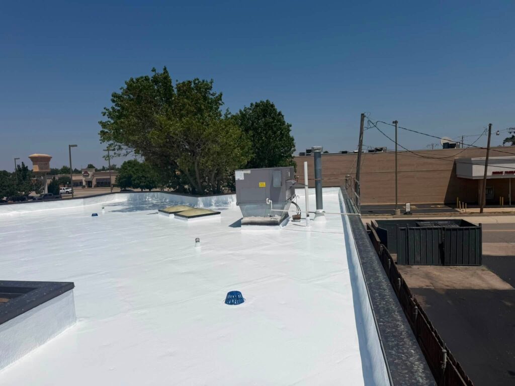Commercial Flat Roof — Tree & Water Tower — photo 26