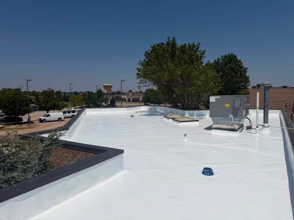Commercial Flat Roof — Tree & Water Tower — photo 28