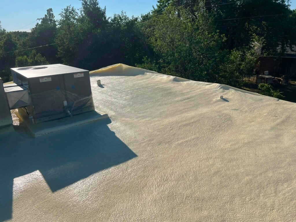 Spray Foam Roof — Red Brick Building — photo 2