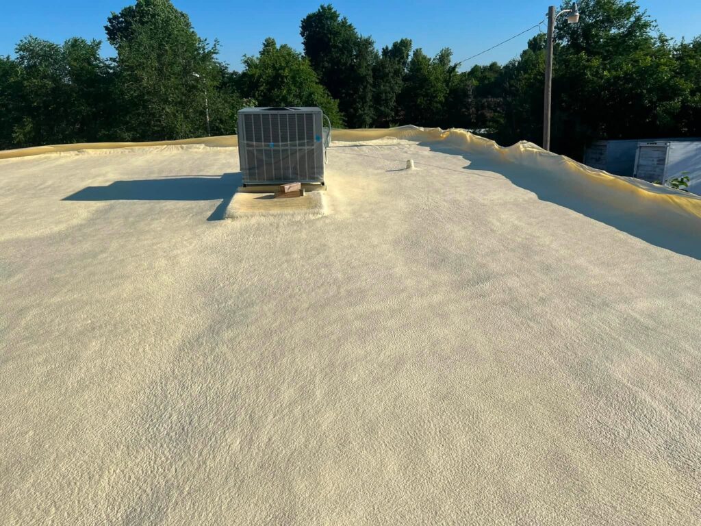 Spray Foam Roof — Red Brick Building — photo 6